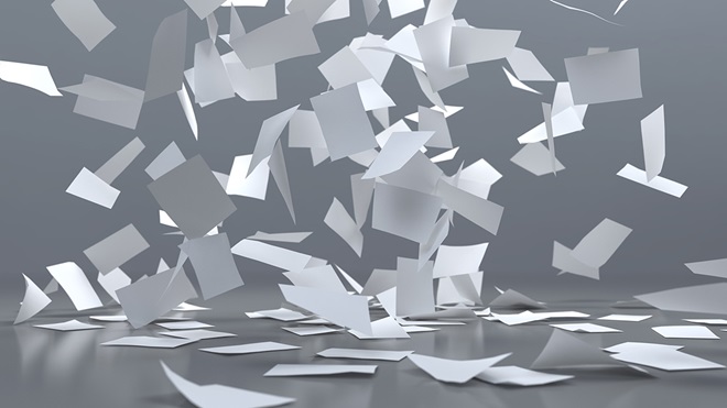 several sheets of paper falling on the floor